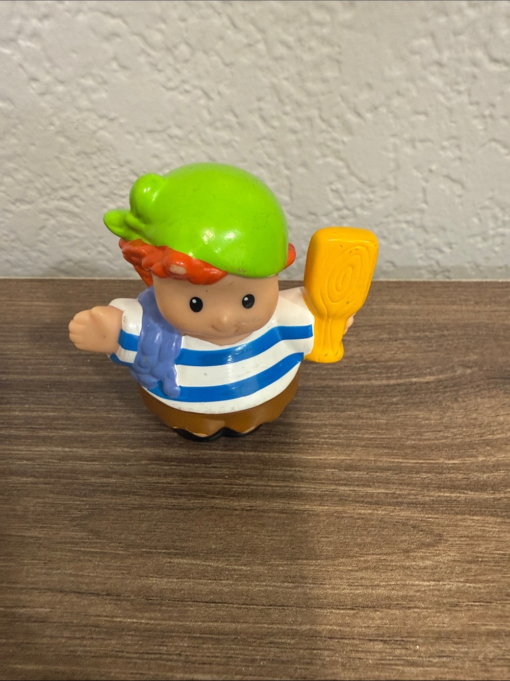 Fisher-Price Little People figure from a pirate ship set, featuring a character
